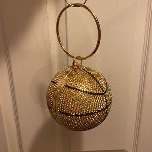 Gold and black basketball purse.